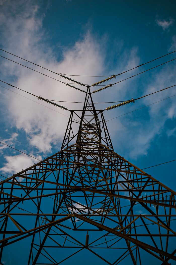Crafting Captivating Headlines: Your awesome post title goes here A dramatic view of a steel power pylon reaching into the sky, showcasing modern energy infrastructure.